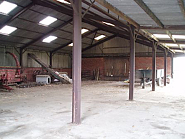 Photo of the inside of a barn building on a working farm